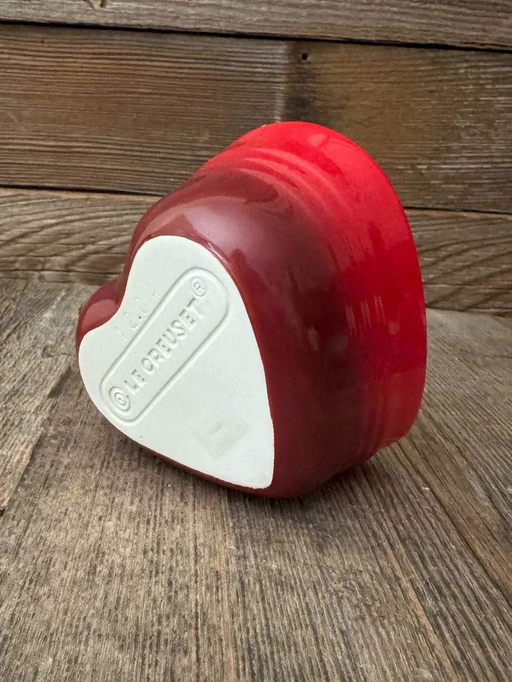 Red Le Creuset heart-shaped stoneware ramekin